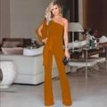 Detail of orange-brown one-shoulder jumpsuit with asymmetric long sleeve and wide leg design - Earthy Yellow
