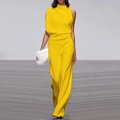 Detail of elegant yellow one-shoulder jumpsuit with draped pleats and wide leg trousers - Yellow