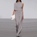 Detail of light grey one-shoulder jumpsuit with elegant draped neckline and wide legs - Space Gray
