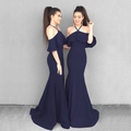 Detail of the ruffle neckline and off-shoulder design on a navy blue fishtail evening dress - Navy Blue