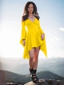 Close-up of bright yellow deep V-neck dress with ruffled sleeves and asymmetric hemline - Yellow