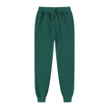 Dettaglio dei joggers verde scuro con coulisse elastica in vita e polsini a costine - S / Verde Scuro