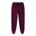 Dettaglio dei pantaloni jogger bordeaux con elastico in vita e coulisse regolabile - S / Borgogna