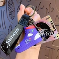 Portachiavi sneaker graffiti viola con cinturino nero intrecciato e ciondoli alla moda - Viola