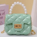 Mint green jelly crossbody bag with quilted pattern, pearl handle, and gold chain strap - Green