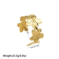 Detail of gold flower bangle showing 58mm diameter and 34.5mm floral motif dimensions - Gold
