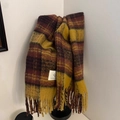 Detailed view of vintage plaid tassel scarf in brown and yellow with woven brand label - British Plaid - Tan