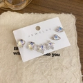 Minimalist 6-piece earring set featuring shimmering geometric crystal studs on jewelry card - Star Stud Earrings Style (GB1053) / 3 Pairs Set