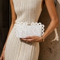 Detail of white marble acrylic clutch featuring distinctive translucent ring ornaments - White Marble Pattern