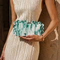 Detail of green marbled acrylic evening clutch bag with round ring handle decoration - Green Marble