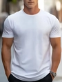 Close-up of quick-dry fabric on white men's round neck t-shirt with premium cotton texture - White