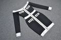 Detail of contrast bandage dress with gold zippers and white stripe accents on pockets - XS / Black