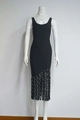Détail de la robe bandage noire sans manches avec franges pailletées sur l'ourlet - XS / Noir