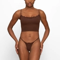 Detail of dark brown two-piece lingerie set featuring lace trim and ribbed stretch fabric - S / Brown