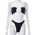 Detail of a black bikini set featuring a 3D white rose on the tube top and high-cut bottom - S / Black