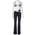 Dettaglio del set top a fascia in mesh con stampa a mano e pantaloni svasati chic - S / Nero