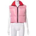Detail of a shiny pink and red reversible puffer vest with a black front zipper closure - M / Tops / Pink and Red