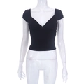 Detail shot of the deep V-neckline and slim fit black crop top on a female mannequin - S / T-Shirts / Black