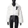 Close-up of white padded jacket with varsity F letter embroidery and faux fur collar - White