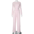 Detail view of light pink two-piece set featuring long sleeve top and wide leg trousers - S / Pink Long Sleeve Outfit