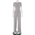 Close-up of gray two-piece set featuring a round neck top and high waist wide leg pants - Gray Short Sleeve Outfit