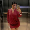 Detail of wine red satin deep V-neck dress with batwing sleeves and wrap hem design - Burgundy