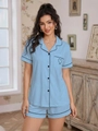 Detail of light blue short sleeve pajama set with black piping and heart pocket design - Sky Blue