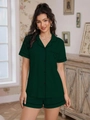 Close-up of dark green short-sleeve pajama top with black piping and heart embroidery - Dark Green