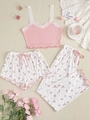 Detailed flat lay of pink ribbed camisole and floral pajama set with lace trim - Pink