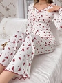 Close-up of floral pajama set featuring red lettuce edge trim and ribbed texture fabric - Burgundy