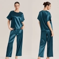 Women's silk satin pajama set in peacock blue featuring short sleeves and long pants - Indigo