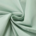 Detail view of breathable mint green cotton fabric with soft texture and natural drape - S / Light Green
