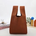 Detailed close-up showing the premium tight knit texture of the caramel mini tote bag - Tea Brown
