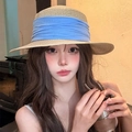Women's wide brim straw sun hat featuring a large light blue ribbon bow decoration - Beige Blue Band Boater Hat (D-508)