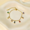 Bracciale dorato in acciaio inossidabile con ciondoli in zircone colorati su seta color champagne - Bracciale Oro-Multicolore