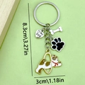 Silver pet keychain featuring dog bone, paw print, heart tag, and cartoon puppy charm - Jumping Dog Paw Bone Heart Style (ER417)