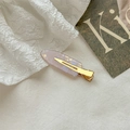 Elegant purple marble acetate hair clip with golden metal grip on white fabric - Metallic Purple