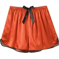 Close-up of rust orange ice silk lounge shorts with black bow and curved hem detail - Orange Red