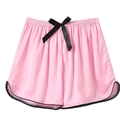 Detail of pink silk sleep shorts featuring elastic waistband and black bow decoration - Rose Pink