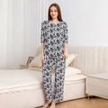 Women's floral cotton pajama set featuring short sleeve top and long pants in white - M / Top And Bottom / Black and White Ditsy Floral