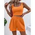Dames tweedelige set in fel oranje met geribbelde crop top en korte broek met hoge taille - S / Oranje