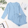Light blue two-piece pajama set with long-sleeved buttoned top and drawstring shorts - Blue