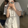 Women's white short-sleeved gauze pajama set with black piping and button-down design - One Size / White