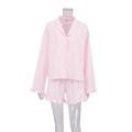 Pink cotton pajama set with long sleeve button-up shirt and ruffled hem shorts - S / Pink