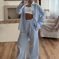 Women striped pajama set with oversized long-sleeve shirt and wide-leg trousers - S / Blue