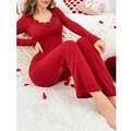Detail of red ribbed pajamas set with elegant lace trim on the V-neck long sleeve top - S / Red