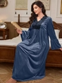Detail of elegant black lace trim on V-neckline of a navy blue velvet nightgown - Blue