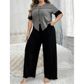 Détail du haut à manches courtes gris et du pantalon large noir en pyjama chic - Gris & Noir