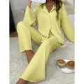 Close-up of yellow crinkle texture pajama set with white piping and chest pockets - Yellow
