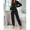 Women's black hooded fleece jumpsuit loungewear with plush waffle texture and pom-pom detail - S / Black